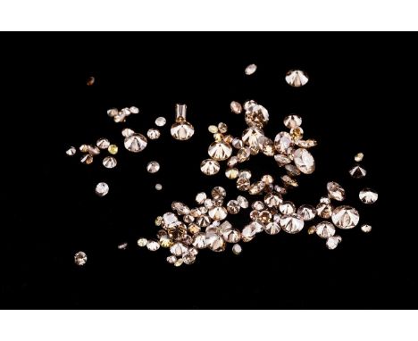 A melee of top light brown and yellow loose diamonds, mixed cuts, total weight 7.06ct.Please note these diamonds have come fr