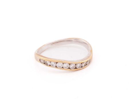 A wavy half-eternity ring set with diamonds, channel-set with nine graduating brilliant-cut diamonds, metal marked '750', siz