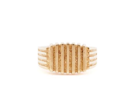 A gentleman's yellow metal signet ring with parallel ridged decoration stamped 18ct, size U, 10.3grams.