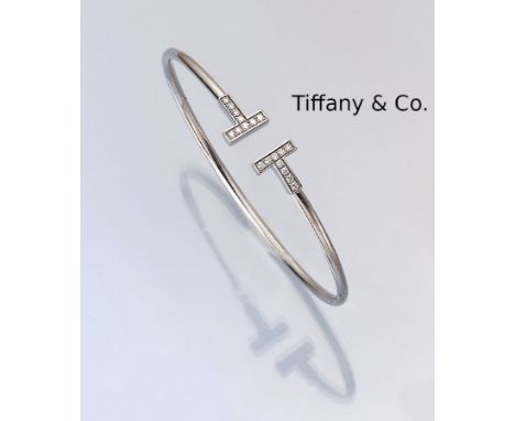 18 kt Gold TIFFANY &amp; CO. Armreif mit Brillanten,   GG 750/000, T-Wire, mit 18 Brillanten zus. ca. 0.26 ct Weiß/si, D. ca.