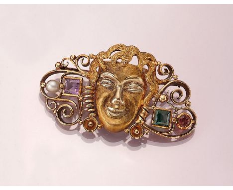 14 kt Gold Brosche 'Maske' mit Farbsteinen undPerlchen,   GG 585/000, z.T. fein grav. und strukt., volutenf. Seiten, z.T. mit