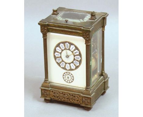 BRASS FOUR PANE CARRIAGE CLOCK,  the enamelled face with French style numerals to the main and alarm dials, on an eight day h