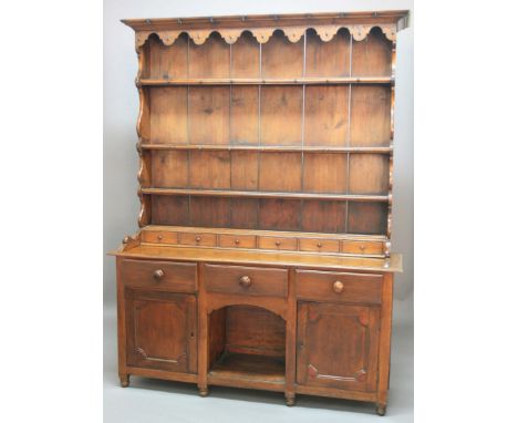 WELSH OAK DRESSER, mid 19th century, Glamorganshire, three shelf plate rack with cup hooks and spice drawers on a base with t