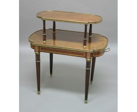 REGENCY MAHOGANY AND BRASS MOUNTED TWO TIER CENTRE TABLE, of rounded rectangular form with brass line inlay and greek key bor