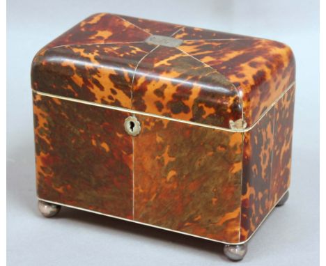 TORTOISESHELL TEA CADDY, early 19th century, of rounded rectangular form, with pewter banding and white metal mounts, twin ca