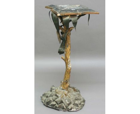 REGENCY STYLE PLANT STAND, modelled in the form of a palm tree, with lozenge shaped top, tole leaves, twisting trunk and rock