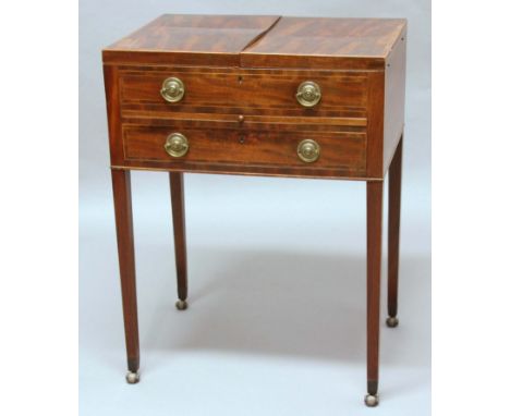 GEORGE III MAHOGANY AND INLAID GENTLEMAN'S DRESSING TABLE, early 19th century, the fold out top enclosing a fitted interior i