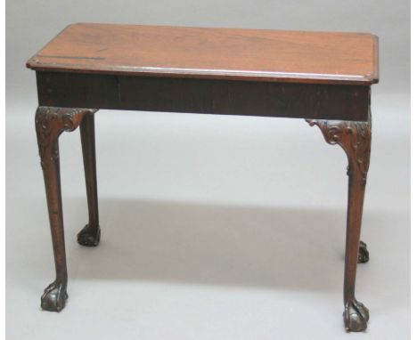 GEORGE II STYLE MAHOGANY SIDE OR SERVING TABLE, the rectangular top with moulded rim and shaped corners above a plain frieze,