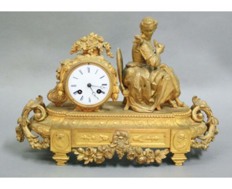 FRENCH GILT METAL MANTEL CLOCK, 19th century, modelled as a seated lady and two birds, 3" enamelled dial on an eight day move