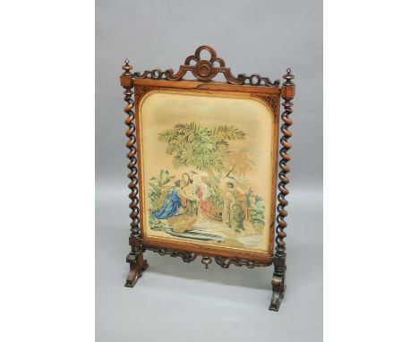 VICTORIAN ROSEWOOD FIRESCREEN, circa 1860, a Berlinwork tapestry of Miriam and Moses in a pierced and fretwork frame with bar