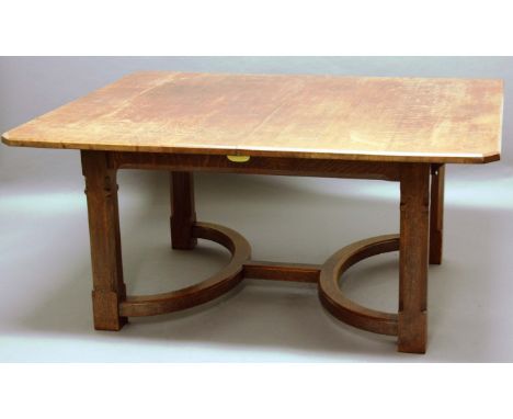 LIBERTY & CO OAK EXTENDING DINING TABLE, of canted rectangular form, raised on canted square section legs with a large, round