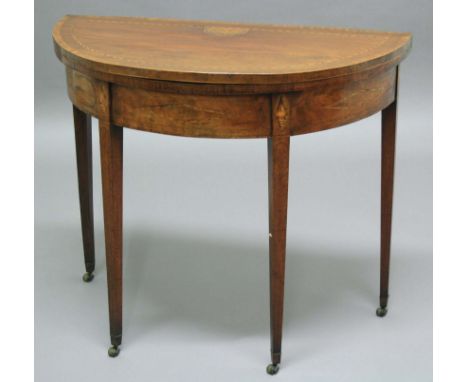 GEORGE III MAHOGANY DEMI-LUNE FOLD-OUT CARD TABLE, early 19th century, with foliate, shell and string inlay, width 92cm