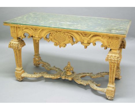 ITALIAN GILTWOOD CENTRE TABLE, 19th century, the faux marble top on a base with scrolling apron on square section legs with t