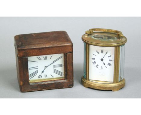 BRASS OVAL FOUR PANE CARRIAGE TIME PIECE, the enamel dial inscribed 'Wall & Son, Ross, Made in Paris', height excluding handl
