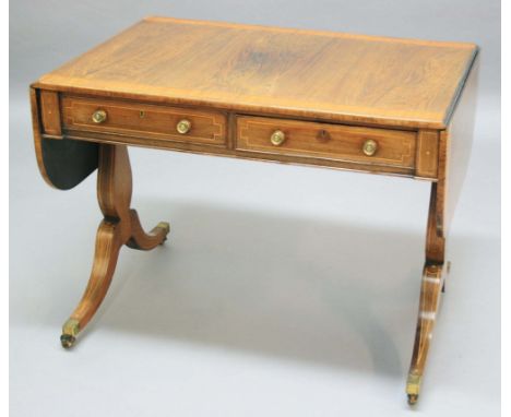 REGENCY ROSEWOOD AND SATINWOOD CROSSBANDED SOFA TABLE, the rounded rectangular top above two opposing true and false drawers 