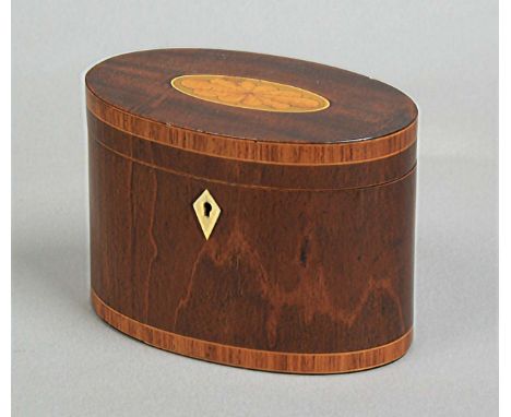 REGENCY MAHOGANY AND INLAID OVAL TEA CADDY, the cover with a central patera, crossbanded rims and ivory escutcheon, width 15c