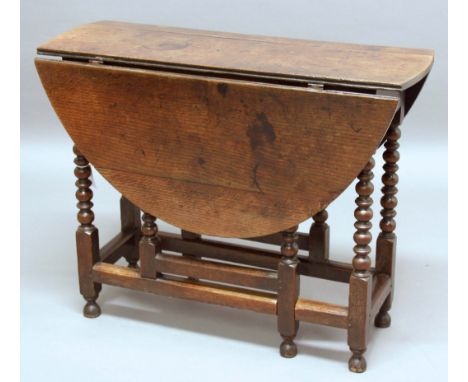 OAK  GATELEG  DINING TABLE, 18th century and later, with oval top and single drawer on bobbin turned legs and block stretcher