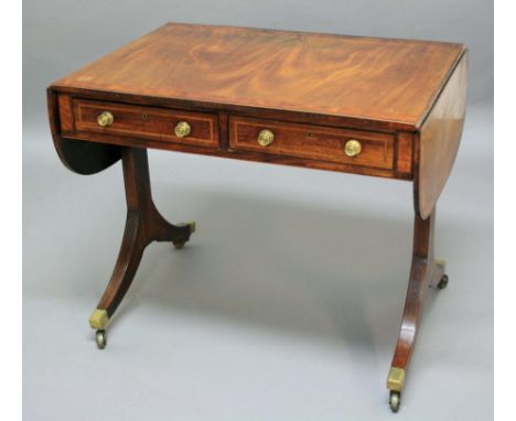 REGENCY MAHOGANY AND CROSSBANDED SOFA TABLE, early 19th century, the rounded rectangular top with satinwood and rosewood band