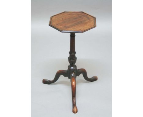 GEORGE III MAHOGANY KETTLE STAND, circa 1760, the octagonal top with moulded rim above a turned column and outswept tripod le