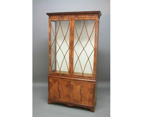 SHERATON STYLE MAHOGANY DISPLAY CABINET,  20th century, the moulded cornice above an arching frieze, pair of astragal glazed 