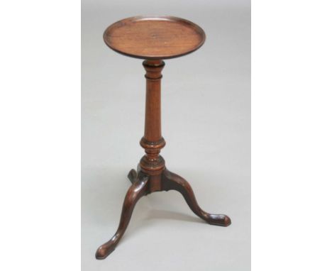 GEORGE III MAHOGANY KETTLE STAND, the circular dished top on a turned column and down swept tripod base, height 58cm, diamete