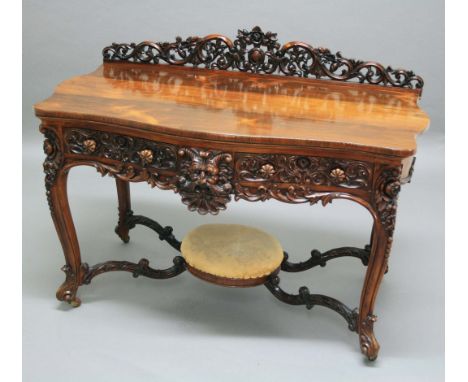 VICTORIAN ROSEWOOD SERVING TABLE, with pierced scrolling gallery centred on a cartouche, on a base with serpentine front and 