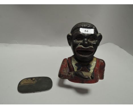 A genuine vintage mechanical cast iron money bank