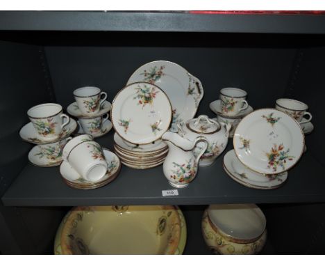 A fine Victorian porcelain part tea service having hand painted floral scenes with gilt borders