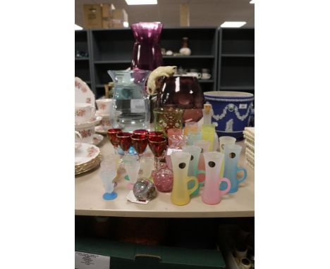 A selection of vintage and modern glass wares including large purple stemmed brandy glass and vase, harlequin glasses and Cai