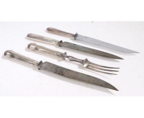 French silver handled carving knife and fork, the engine turned handles with vacant oval cartouches, the knife blade stamped 