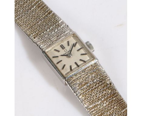 Omega 9 carat white gold ladies wristwatch, the signed silver dial with baton markers, manual wound, the case 14.5mm wide, on