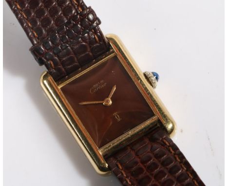 A Cartier Must de Cartier ladies silver gilt wristwatch, with signed chocolate colour dial, manual wound, the case 21mm wide