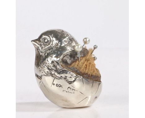 Edwardian silver pin cushion by Sampson Mordan &amp; Co Ltd, Chester, marks rubbed, modelled as a chick emerging from it's eg