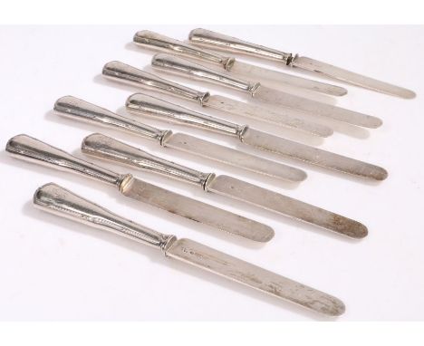 Nine French silver handled dessert knives, the steel blades stamped "ODIOT", the ribbon and bow handles monogrammed RB