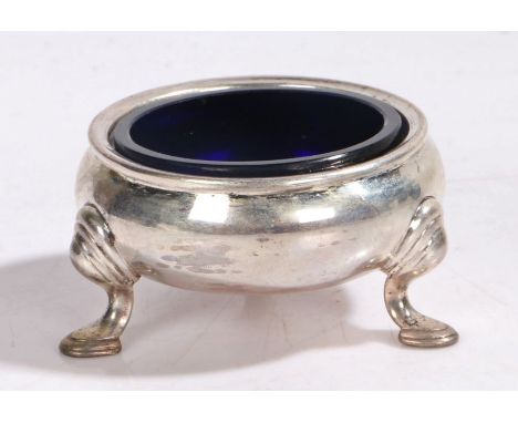 George II silver salt, London 1734, makers mark rubbed, of cauldron form, raised on three stepped pad feet, with blue glass l