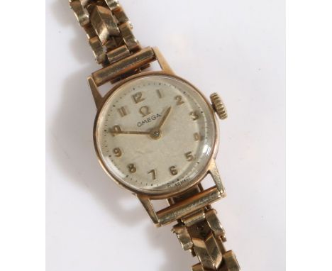Omega 9ct gold ladies wristwatch, the signed cream dial with Arabic markers, manual wound, the case 19mm diameter, total weig