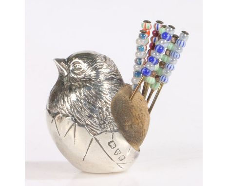 Edwardian silver pin cushion by Sampson Mordan &amp; Co Ltd, Chester, marks rubbed, modelled as a chick emerging from it's eg