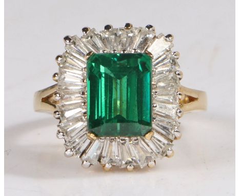 14 carat gold filled diamond and paste emerald ring, the head set with a emerald cut emerald surrounded by baguette cut diamo