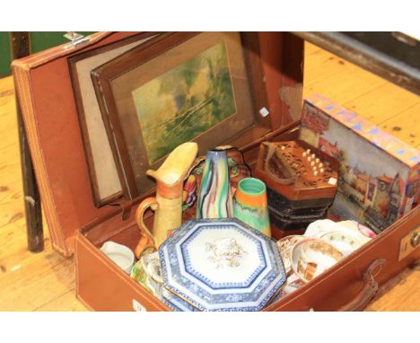 Vintage suitcase with accordion, vases, china, jigsaw and pictures