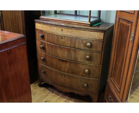 Victorian mahogany bow front chest of four long drawers on splayed bracket feet