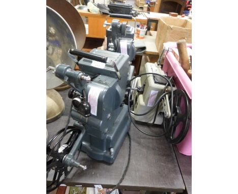 Three vintage film projectors