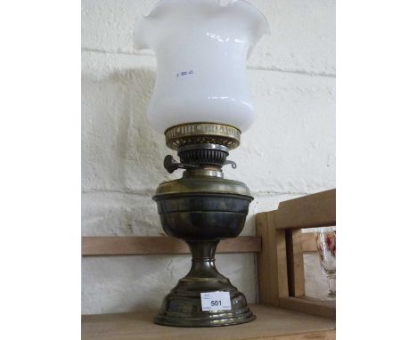A brass based oil lamp