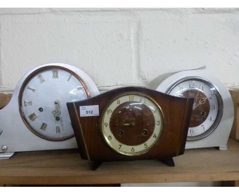 Two silver painted mantel clocks and one other