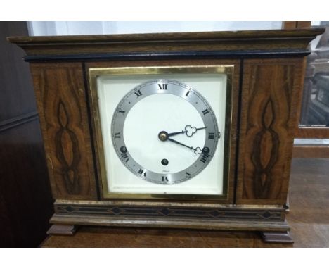 An Elliott eight-day clock with striking movement, in oak case with brass plaque with inscriptions on verso "Presented to Cap