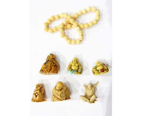 A small jade fish, carved netsuke of crouching wise gentleman, three other netsuke, carved ivory bead necklace, a Japanese fi