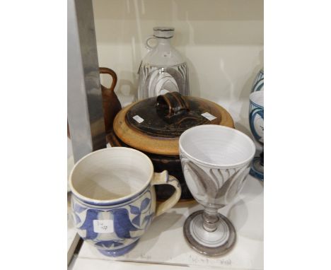 An Aldermaston decanter, ovoid with matching goblet painted in brown on grey ground together with a two-handled studio potter