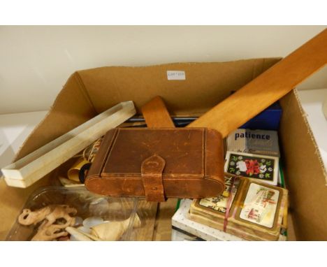 A bakelite handled manicure and travelling vanity set in folding leather case, a quantity of horn napkin rings, a pair of Shr