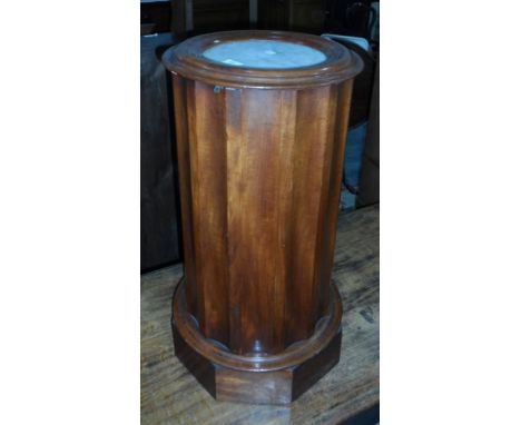 A mahogany circular cabinet with marbled top, enclosed shelf (the top has broken off), 40cm wide 