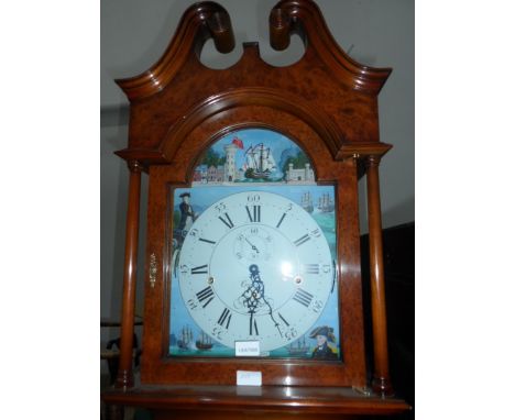 A 20th century walnut veneered longcase clock, painted dials depicting fighting fleet and commanders 