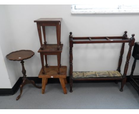 An early 20th century mahogany umbrella stand with turned supports and five compartments with drip tray beneath, a tripod lam